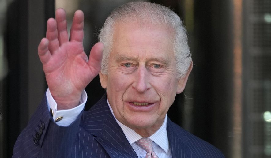 FILE - Britain's King Charles III waves as he arrives for a visit to University College Hospital Macmillan Cancer Centre in London, Tuesday, April 30, 2024. (AP Photo/Kin Cheung, File)