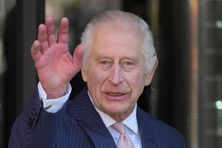 FILE - Britain's King Charles III waves as he arrives for a visit to University College Hospital Macmillan Cancer Centre in London, Tuesday, April 30, 2024. (AP Photo/Kin Cheung, File)