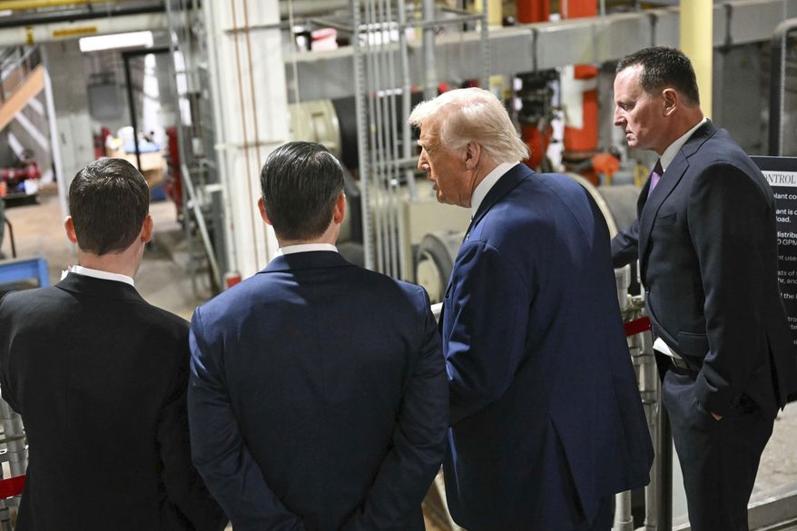 President Donald Trump talks with Kennedy Center Board of Trustees president Richard Grenell, right, as he tours the John F. Kennedy Center for the Performing Arts in Washington, Monday, March 17, 2025. (Jim Watson, Pool via AP)
