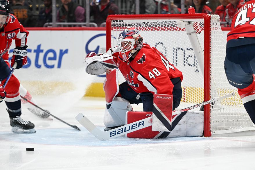 Washington Capitals goalie Logan Thompson (48) tracks the puck after making a save during the first period of an NHL game against the Detroit Red Wings at Capital One Arena in Washington D.C., March 18, 2025. (Photo for the Washington Times)
