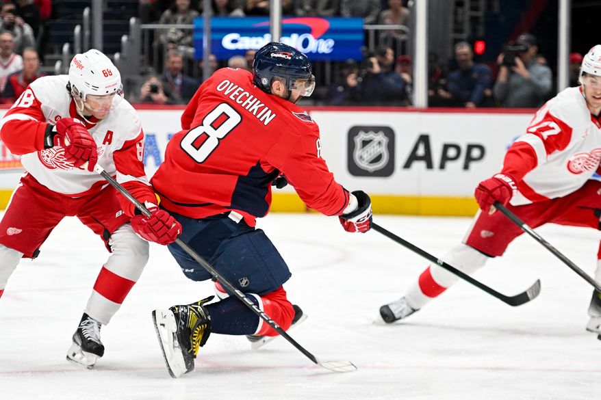 Washington Capitals left wing Alex Ovechkin (8) following through after taking a shot during the second period of an NHL game against the Detroit Red Wings at Capital One Arena in Washington D.C., March 18, 2025. (Photo for the Washington Times)