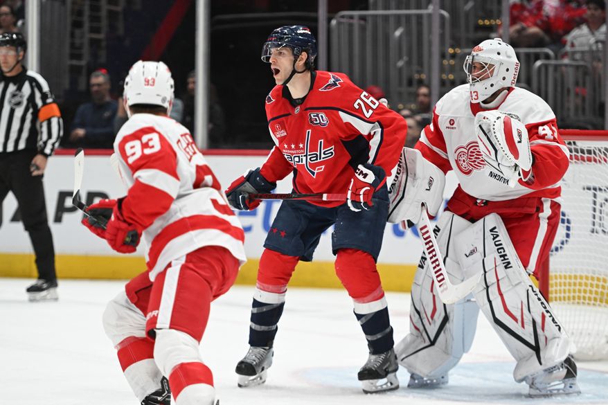 Washington Capitals center Nic Dowd (26) standing in front of Detroit Red Wings goalie Petr Mrazek (43)during the second period of an NHL game against the Detroit Red Wings at Capital One Arena in Washington D.C., March 18, 2025. (Photo for the Washington Times)