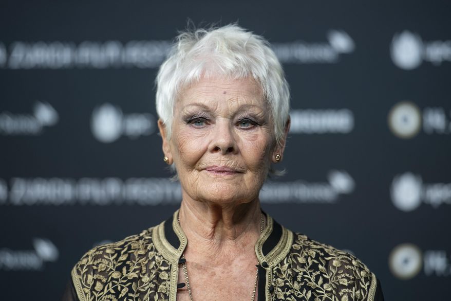 British actress Judi Dench poses on the Green Carpet before the screening of the movie "Red Joan" at the 14th Zurich Film Festival (ZFF) in Zurich, Switzerland, Wednesday, Oct. 3, 2018. (Patrick Huerlimann/Keystone via AP) **FILE**