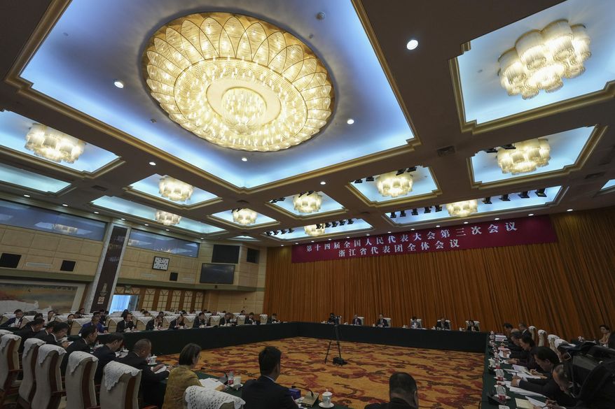 Wang Hao, Zhejiang Province Communist Party Secretary, leads a deliberation on the government work report, on the sideline of the National People's Congress, in Beijing, Thursday, March 6, 2025. (AP Photo/Andy Wong)