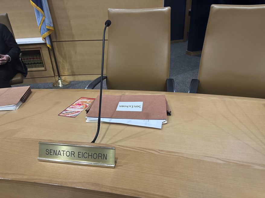 The chair for Minnesota state Sen. Justin Eichorn, a Republican from Grand Rapids, sits empty in a Senate hearing room in the State Capitol complex in St. Paul on Tuesday, March 18, 2025, a day after his arrest in Bloomington for allegedly soliciting a minor for prostitution. (AP Photo/Steve Karnowski)
