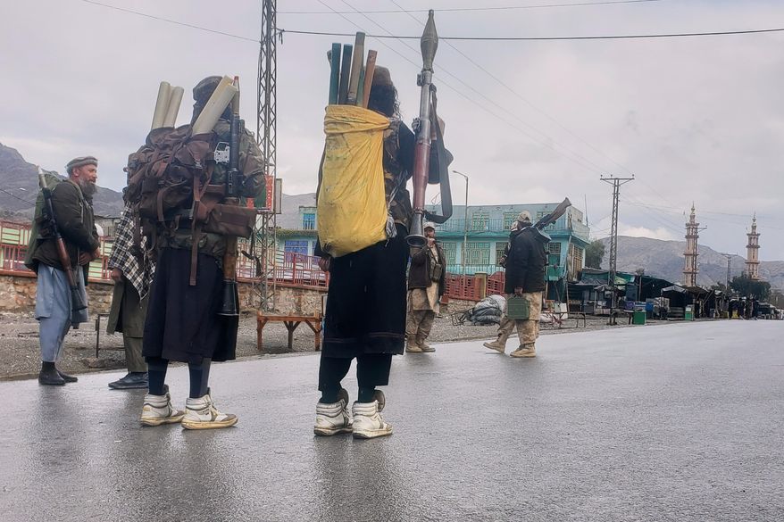 Taliban fighters stand near the closed Torkham border with Pakistan, where Pakistani and Afghan forces exchanged fire overnight, in Torkham, Afghanistan, Monday, March 3, 2025.(AP Photo/Shafiullah Kakar, file)