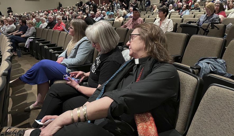 Attendees sit during a town hall with U.S. Rep. Mike Flood, R-Neb., on Tuesday, March 18, 2025, in Columbus, Neb. Many attendees demanded answers over Flood's support for President Donald Trump's policies. (AP Photo/Margery Beck)