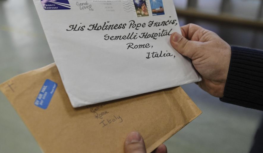 An employee of the Belsito postal distribution center in Rome sorts letters addressed to Pope Francis, who is currently being treated at Rome's Agostino Gemelli Polyclinic for bilateral pneumonia, Wednesday, March 19, 2025. (AP Photo/Chris Warde-Jones)