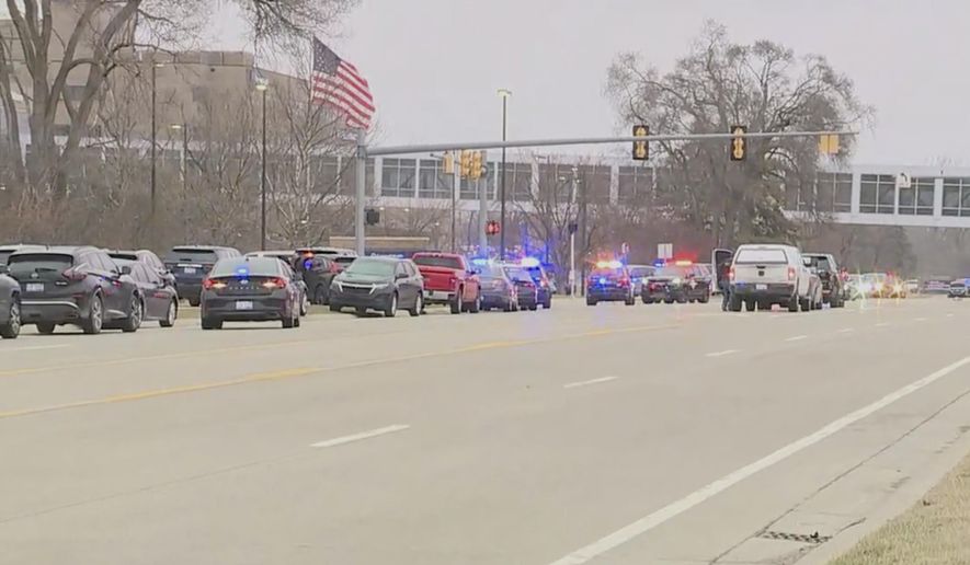 Police respond to the scene of a shooting at Corewell Health Beaumont Troy Hospital, Thursday, March 20, 2025 in Troy, Mich. (WXYZ-TV via AP)