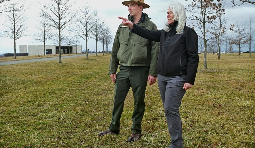 Flight 93 National Memorial Chief of Interpretation and Education Adam Shaffer, left, talks with Friends of Flight 93 National Memorial Executive Director Donna Gibson near the Allée Trail amid the 40 Memorial Groves at the national park near Shanksville, Pa., on Thursday, March 20, 2025. (Thomas Slusser/The Tribune-Democrat via AP)