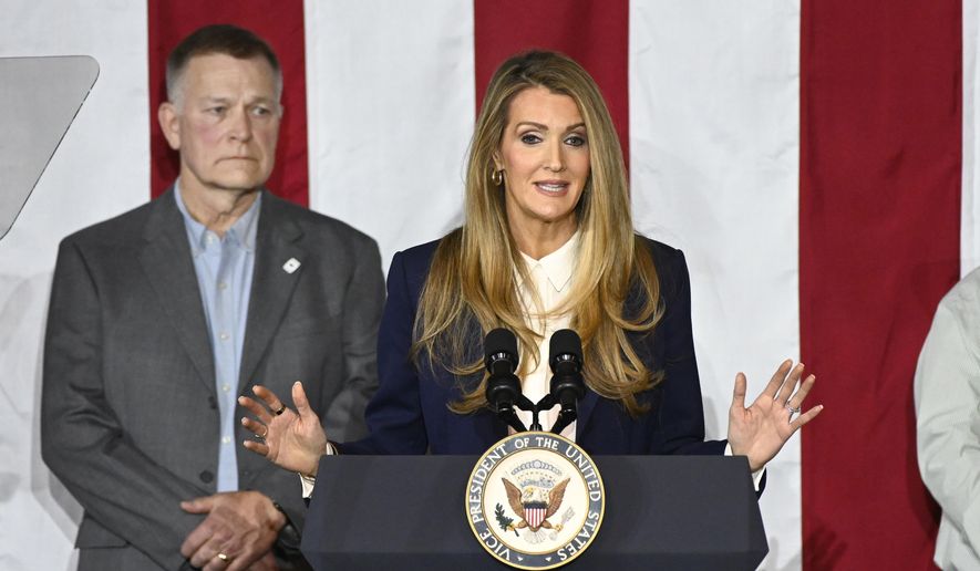 Administrator of the Small Business Administration Kelly Loeffler, right, speaks at a rally before Vice President J.D. Vance (not shown) speaks about "America's industrial resurgence," Friday, March 14, 2025, at Vantage Plastics in Bay City, Mich. At left is Vantage Plastics President Paul Aultman. (AP Photo/Jose Juarez, File)