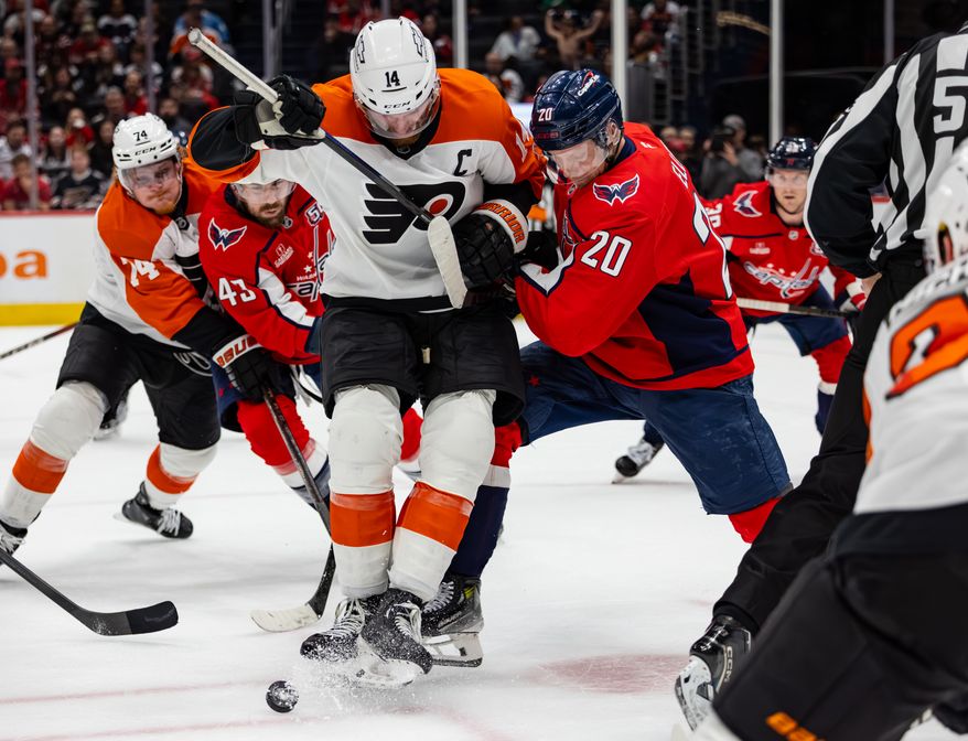 Washington Capitals center Lars Eller (20) goes after possession of the puck at a hockey game against the Philadelphia Flyers on March 20 2025 at Capital One Arena in Washington D.C. (Alyssa Howell/ Washington Times)
