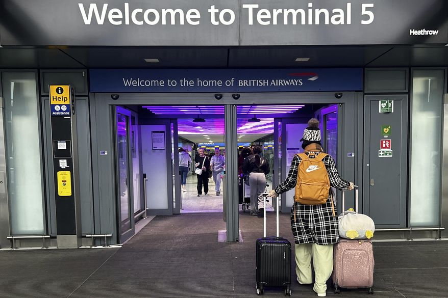 Travellers arrive at Terminal 5 as Heathrow Airport slowly resumes flights after a fire cut power to Europe's busiest airport in London, Saturday, March 22, 2025.(AP Photo/Kirsty Wigglesworth)