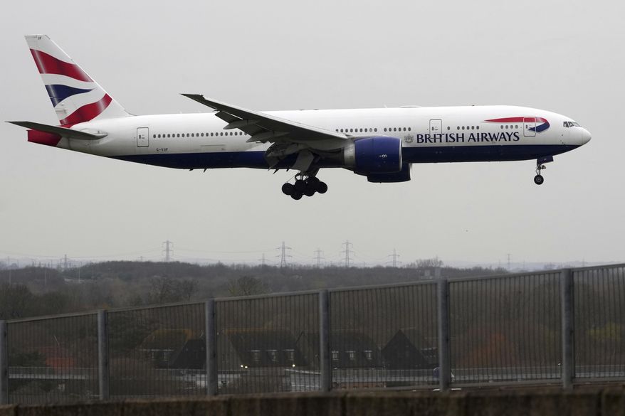 A British Airways plane approaches landing as Heathrow Airport slowly resumes flights after a fire cut power to Europe's busiest airport in London, Saturday, March 22, 2025.(AP Photo/Kirsty Wigglesworth)