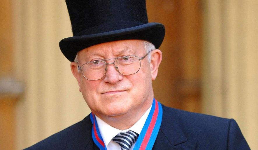FILE- Former Soviet spy Oleg Gordievsky after receiving the Companion of the Most Distinguished Order of St Michael and Saint George from Queen Elizabeth II at Buckingham Palace in London, Oct. 17, 2007. (Fiona Hanson/PA via AP, file)