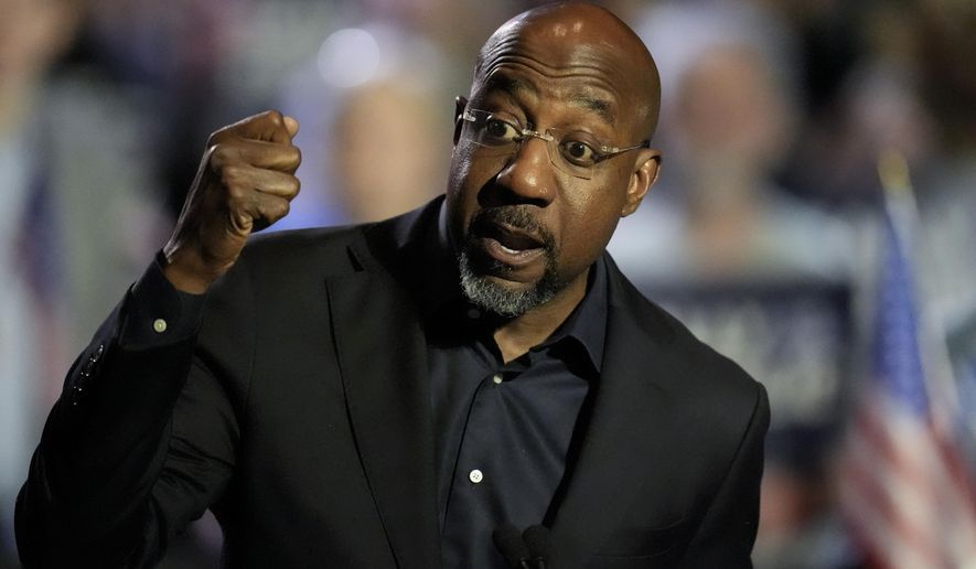 U.S. Sen. Raphael Warnock, D-Ga., speaks during a Rally for our Republic gathering, Saturday, March 22, 2025, in Atlanta. (AP Photo/Mike Stewart)
