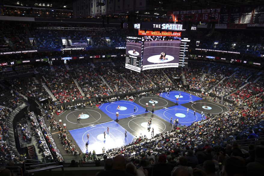 Wrestlers compete in the NCAA wrestling championships, Thursday, March 20, 2025, in Philadelphia. (AP Photo/Matt Rourke)
