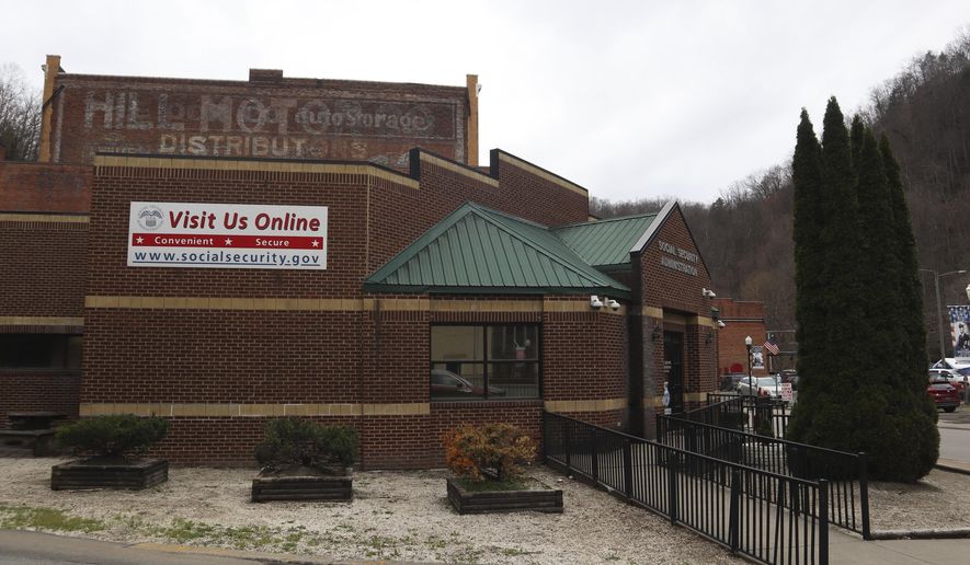 A sign outside the U.S. Social Security Administration advertises its online services in downtown Welch, W.Va., Thursday, March 20, 2025. (AP Photo/Leah Willingham)