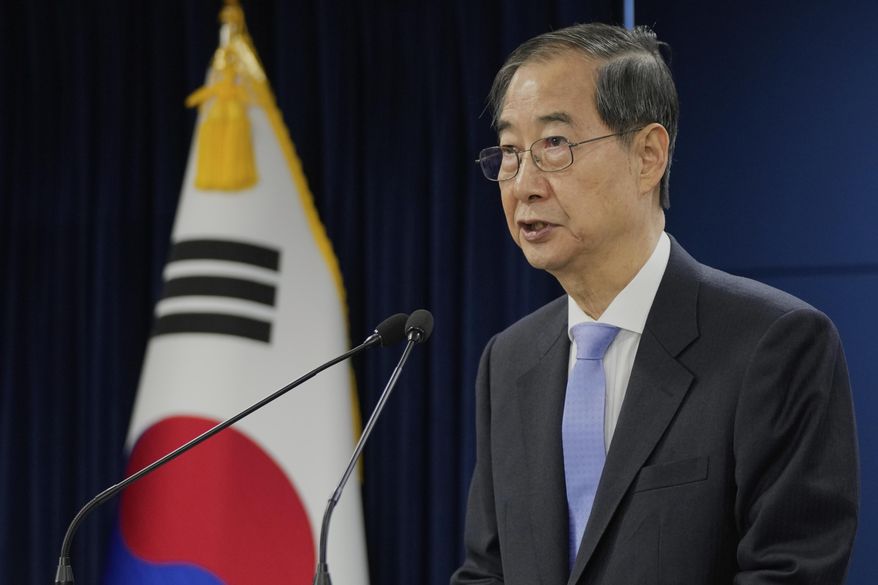 South Korean acting President Han Duck-soo speaks during a briefing at the Government Complex in Seoul, South Korea, Monday, March 24, 2025. (AP Photo/Ahn Young-joon, Pool)