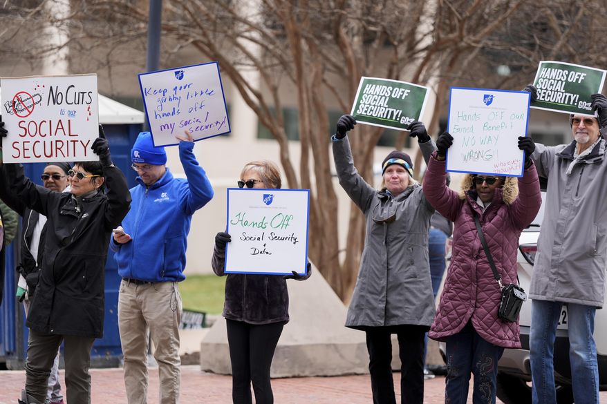 FILE - Demonstrators gather outside of the Edward A. Garmatz United States District Courthouse in Baltimore, on Friday, March 14, 2025, before a hearing regarding the Department of Government Efficiency's access to Social Security data. (AP Photo/Stephanie Scarbrough, File)