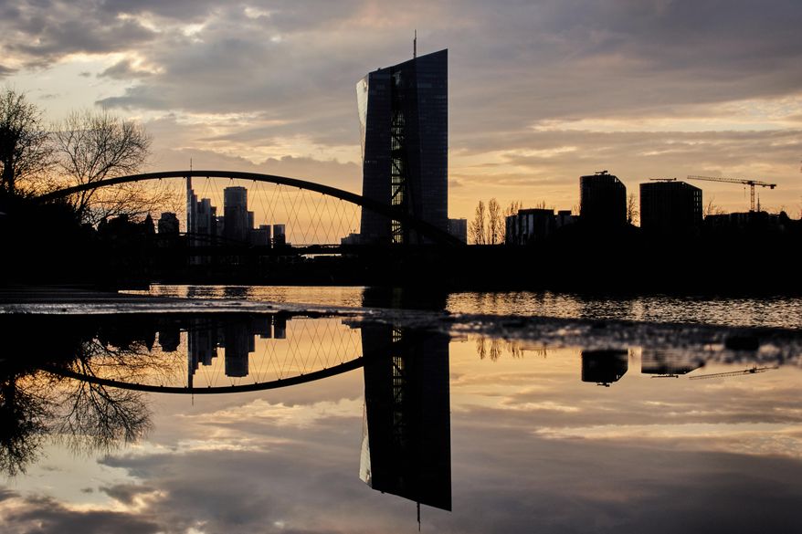 The European Central Bank is reflected in a puddle in Frankfurt, Germany, Monday, March 24, 2025. (AP Photo/Michael Probst) ** FILE **