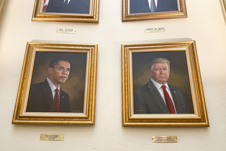 Portraits of President Donald Trump and former President Barack Obama hang in the Capitol Rotunda in Denver on Monday, March 24, 2025. (AP Photo/Jesse Bedayn)