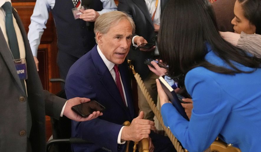 Texas Gov. Greg Abbott speaks with reporters after President Donald Trump spoke at an education event and executive order signing in the East Room of the White House in Washington, Thursday, March 20, 2025. (AP Photo/Ben Curtis)