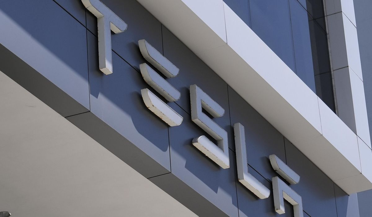 NextImg:Man arrested, charged with defacing Teslas in D.C.