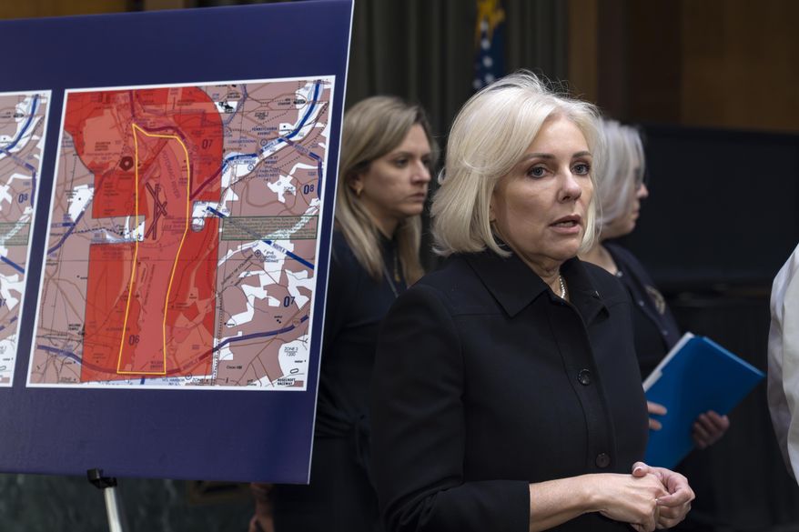 Jennifer Homendy, chair of the National Transportation Safety Board, stands next to map showing flight restrictions as the Senate Transportation Subcommittee holds a hearing to examine the preliminary report by the National Transportation Safety Board on the Jan. 29, 2024, midair collision of an Army Black Hawk helicopter and an American Airlines regional jet, on Capitol Hill in Washington, Thursday, March 27, 2025. (AP Photo/J. Scott Applewhite)