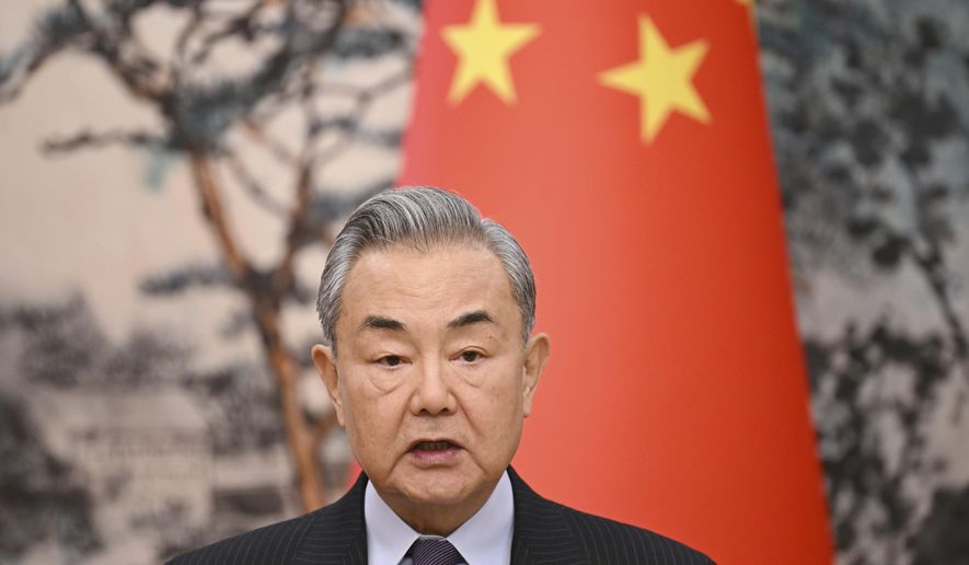 China's Foreign Minister Wang Yi speaks during a joint briefing with French Foreign Minister Jean-Noel Barrot at the Diaoyutai State Guesthouse in Beijing on Thursday, March 27, 2025. (Greg Baker/Pool Photo via AP)