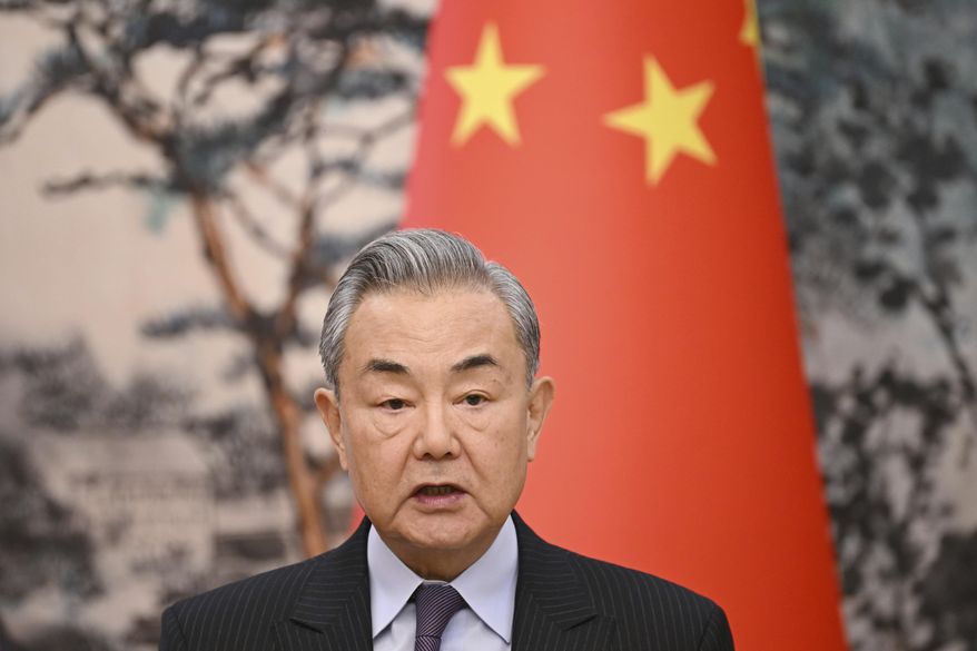 China's Foreign Minister Wang Yi speaks during a joint briefing with French Foreign Minister Jean-Noel Barrot at the Diaoyutai State Guesthouse in Beijing on Thursday, March 27, 2025. (Greg Baker/Pool Photo via AP)