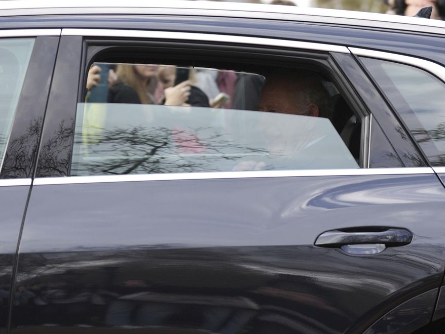 Britain's King Charles III is driven by car from Clarence House, his London home, along The Mall towards Buckingham Palace in London, Friday, March 28, 2025. (Ben Whitley/PA via AP)