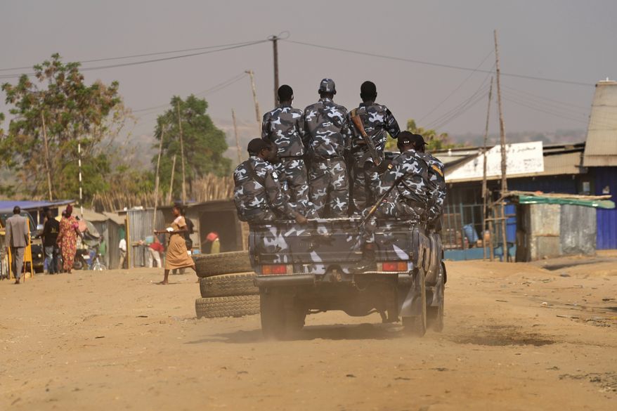 South Sudan soldiers patrol the street in Juba, South Sudan on Thursday, Feb. 13, 2025. (AP Photo/Brian Inganga)