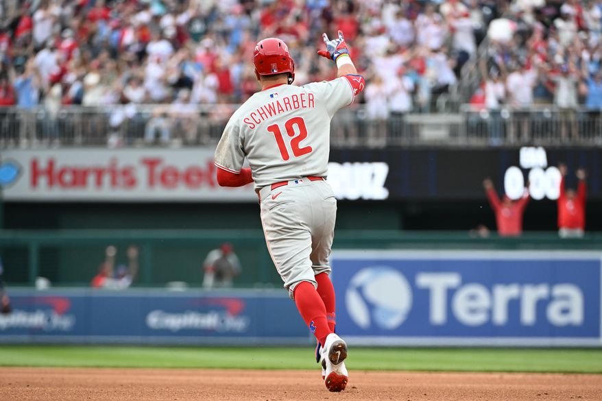 Philadelphia Phillies designated hitter Kyle Schwarber (12) rounding the bases after hitting a home run during the sixth inning of an MLB game against the Washington Nationals at Nationals Park in Washington D.C., March 29, 2025. (Photo by All-Pro Reels for Washington Times Sports)