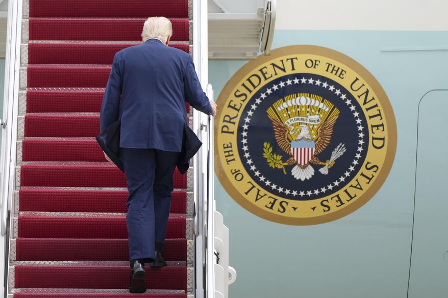 President Donald Trump boards Air Force One at Joint Base Andrews, Md., Friday, March 28, 2025, en route to Florida for the weekend. (AP Photo/Jacquelyn Martin)