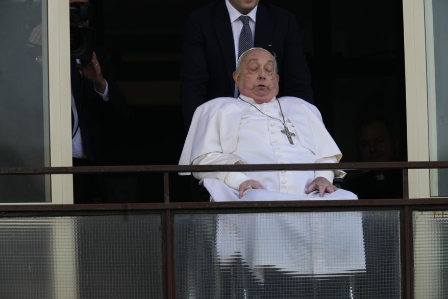 Pope Francis appears at a window of the Agostino Gemelli Polyclinic in Rome, Sunday, March 23, 2025, where he has been treated for bronchitis and bilateral pneumonia since Feb. 14. (AP Photo/Domenico Stinellis, File)