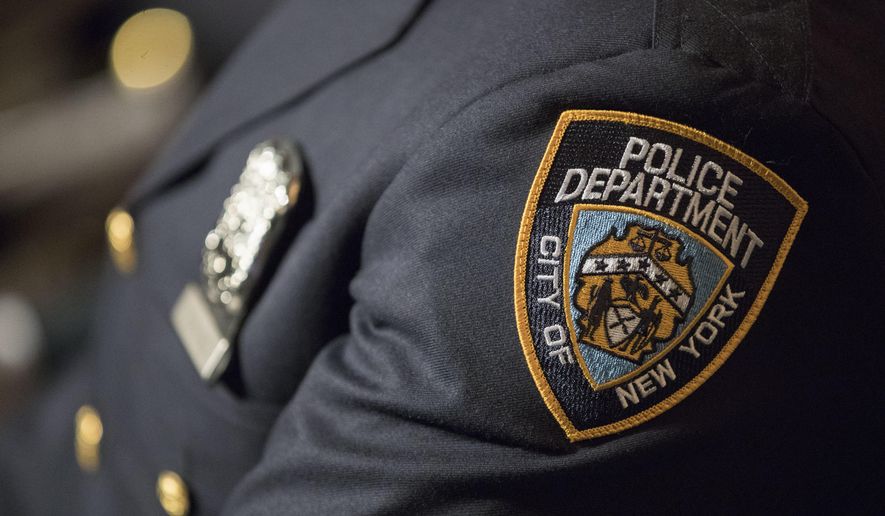 A detail including the badge and shield of one of the newest members of the New York City police is seen during his graduation ceremony, Thursday, June 29, 2017, in New York. (AP Photo/Mary Altaffer, file)