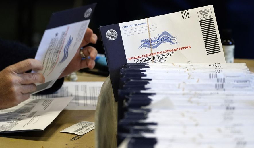 Chester County, Pa., election workers process mail-in and absentee ballots at West Chester University in West Chester, Pa., on Nov. 4, 2020. (AP Photo/Matt Slocum) **FILE**