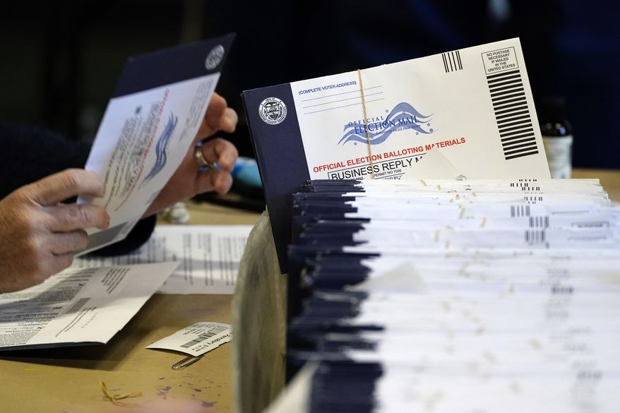 Chester County, Pa., election workers process mail-in and absentee ballots at West Chester University in West Chester, Pa., on Nov. 4, 2020. (AP Photo/Matt Slocum) **FILE**