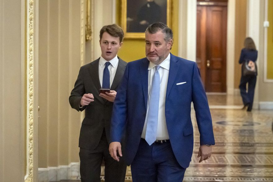 Sen. Ted Cruz, R-Texas, walks to the Senate chamber as the Senate works to avert a partial government shutdown ahead of the midnight deadline, at the Capitol in Washington, Friday, March 14, 2025. (AP Photo/Ben Curtis) **FILE**