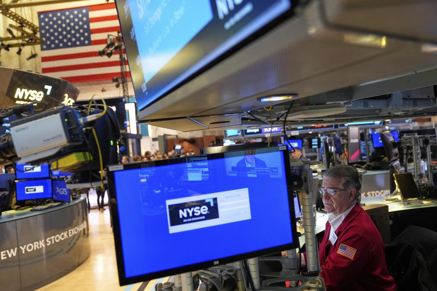 Daniel Kryger works on the floor at the New York Stock Exchange in New York, Wednesday, April 2, 2025. (AP Photo/Seth Wenig)