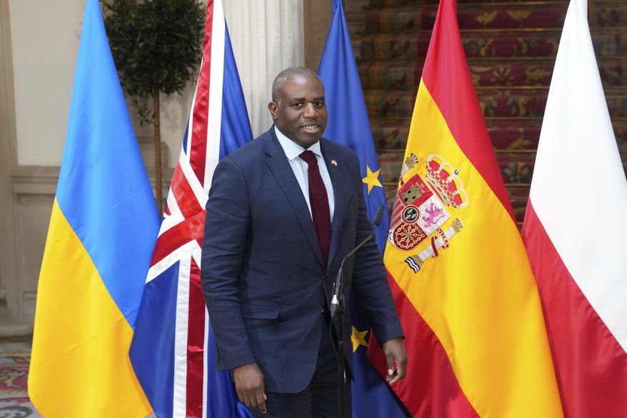 British Foreign Secretary David Lammy arrives to speak during a G5+ Foreign Ministers meeting in Madrid, Spain, Monday March 31, 2025. (AP Photo/Paul White)