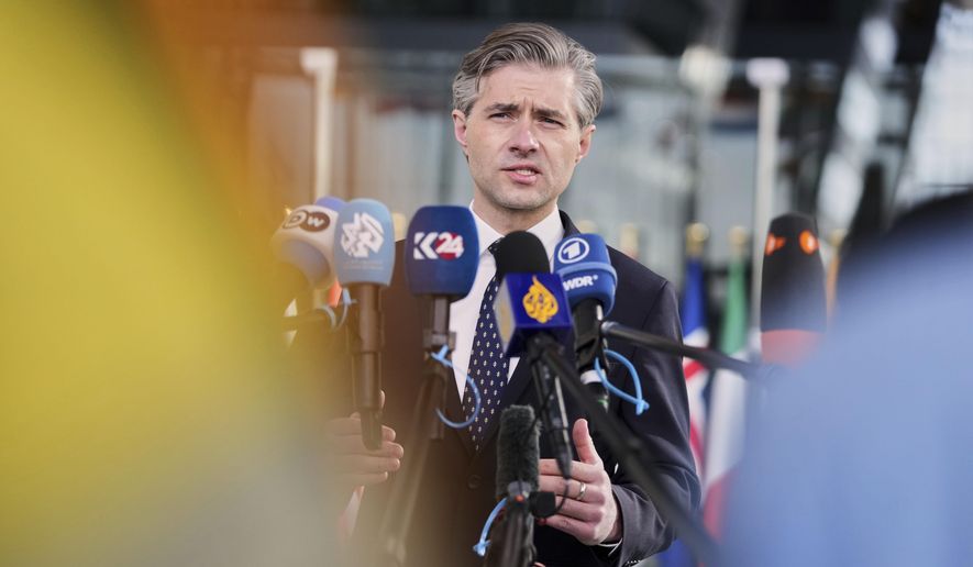 Lithuania's Foreign Minister Kestutis Budrys speaks with the media as he arrives for a meeting of NATO foreign ministers at NATO headquarters in Brussels, Thursday, April 3, 2025. (AP Photo/Virginia Mayo)