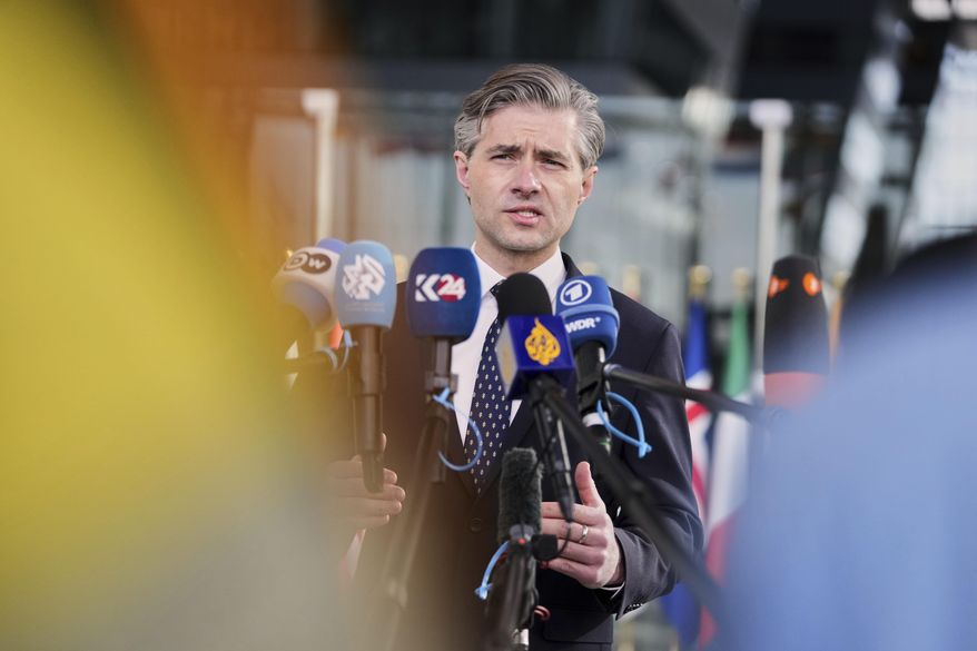 Lithuania's Foreign Minister Kestutis Budrys speaks with the media as he arrives for a meeting of NATO foreign ministers at NATO headquarters in Brussels, Thursday, April 3, 2025. (AP Photo/Virginia Mayo)