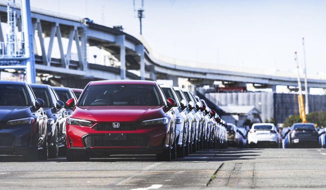 This photo shows vehicles bound for foreign countries at Daikoku Pier in Yokohama near Tokyo, March 7, 2025. (Motoshi Ogura/Kyodo News via AP) ** FILE **