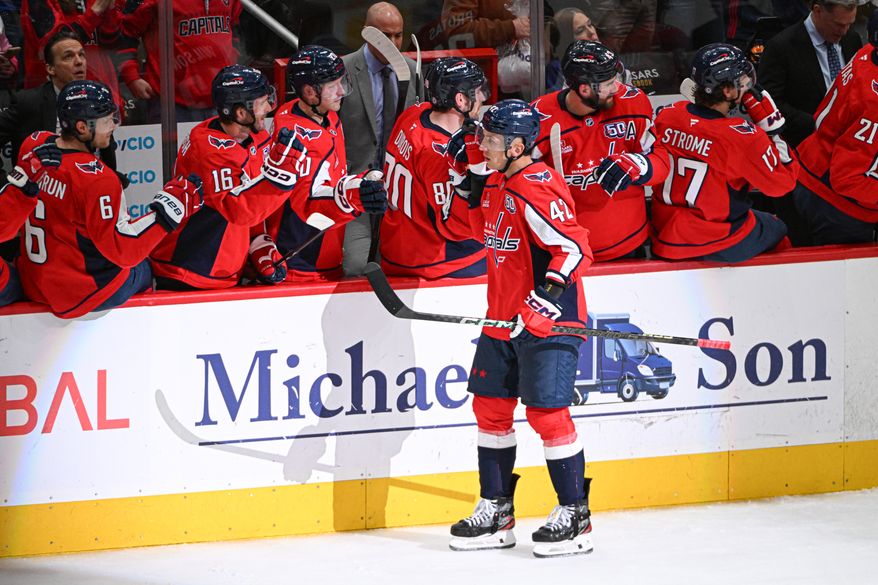 Washington Capitals defenseman Martin Fehervary (42) getting congratulations from the bench after scoring a goal during the second period of an NHL game against the Chicago Blackhawks at Capital One Arena in Washington D.C., April 4, 2025. (Photo for the Washington Times)
