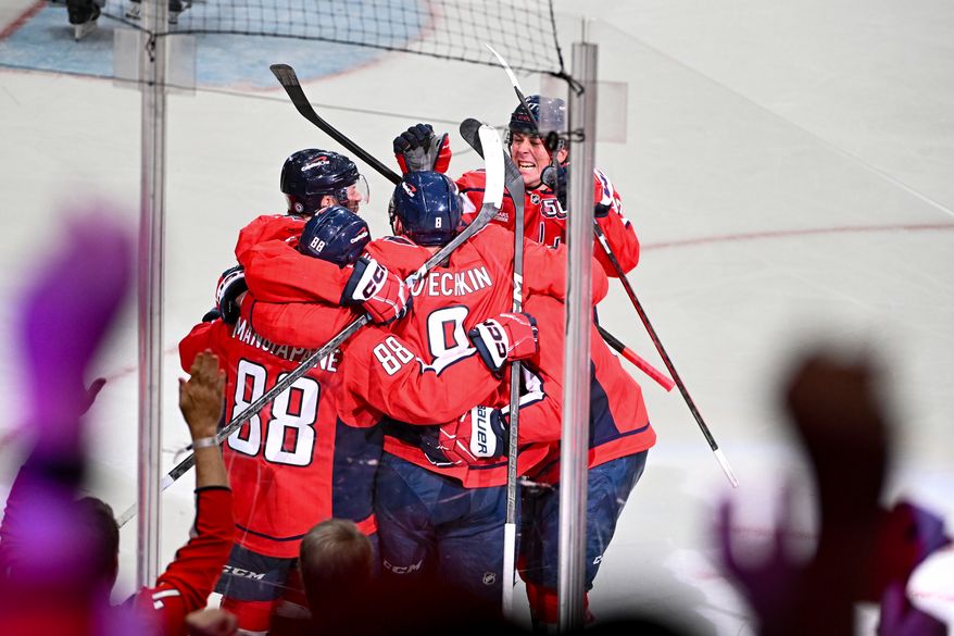 Washington Capitals left wing Alex Ovechkin (8) celebrating with teammates after scoring goal 894 during the third period of an NHL game against the Chicago Blackhawks at Capital One Arena in Washington D.C., April 4, 2025. (Photo for the Washington Times)