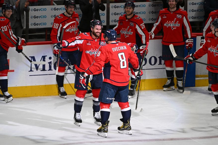 Washington Capitals left wing Alex Ovechkin (8) getting congratulated by teammate Tom Wilson (43) after scoring goal 894 during the third period of an NHL game against the Chicago Blackhawks at Capital One Arena in Washington D.C., April 4, 2025. (Photo for the Washington Times)