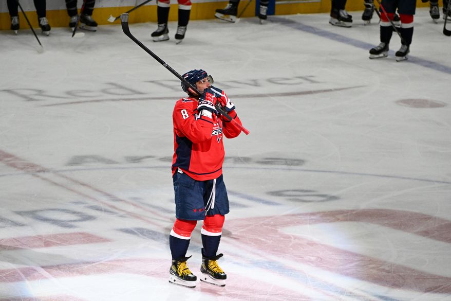 Washington Capitals left wing Alex Ovechkin (8) blowing kisses to the crowd after scoring goal 894 during the third period of an NHL game against the Chicago Blackhawks at Capital One Arena in Washington D.C., April 4, 2025. (Photo for the Washington Times)