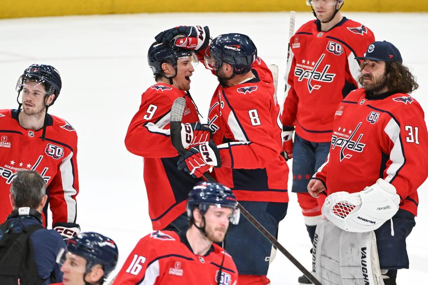 Washington Capitals left wing Alex Ovechkin (8) greeting teammate Ryan Leonard (9) after the team’s 5-3 win over the Chicago Blackhawks at Capital One Arena in Washington D.C., April 4, 2025. Ovechkin scored goal number 894 in the win. (Photo for the Washington Times)